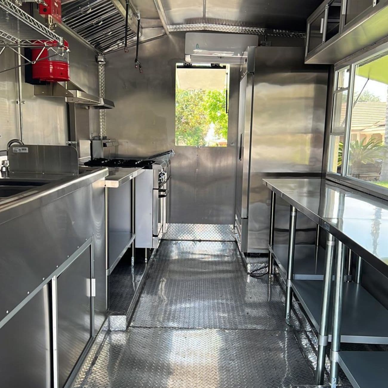 Completed stainless steel commercial kitchen inside a custom food trailer