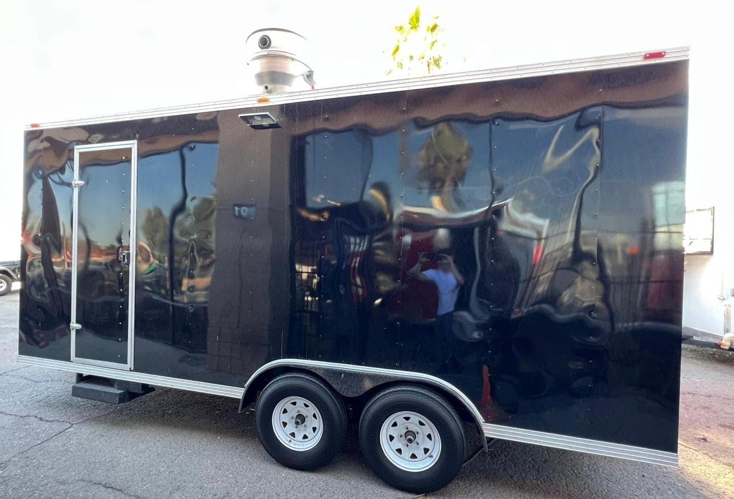 Delivered food trailer with a dark custom finish